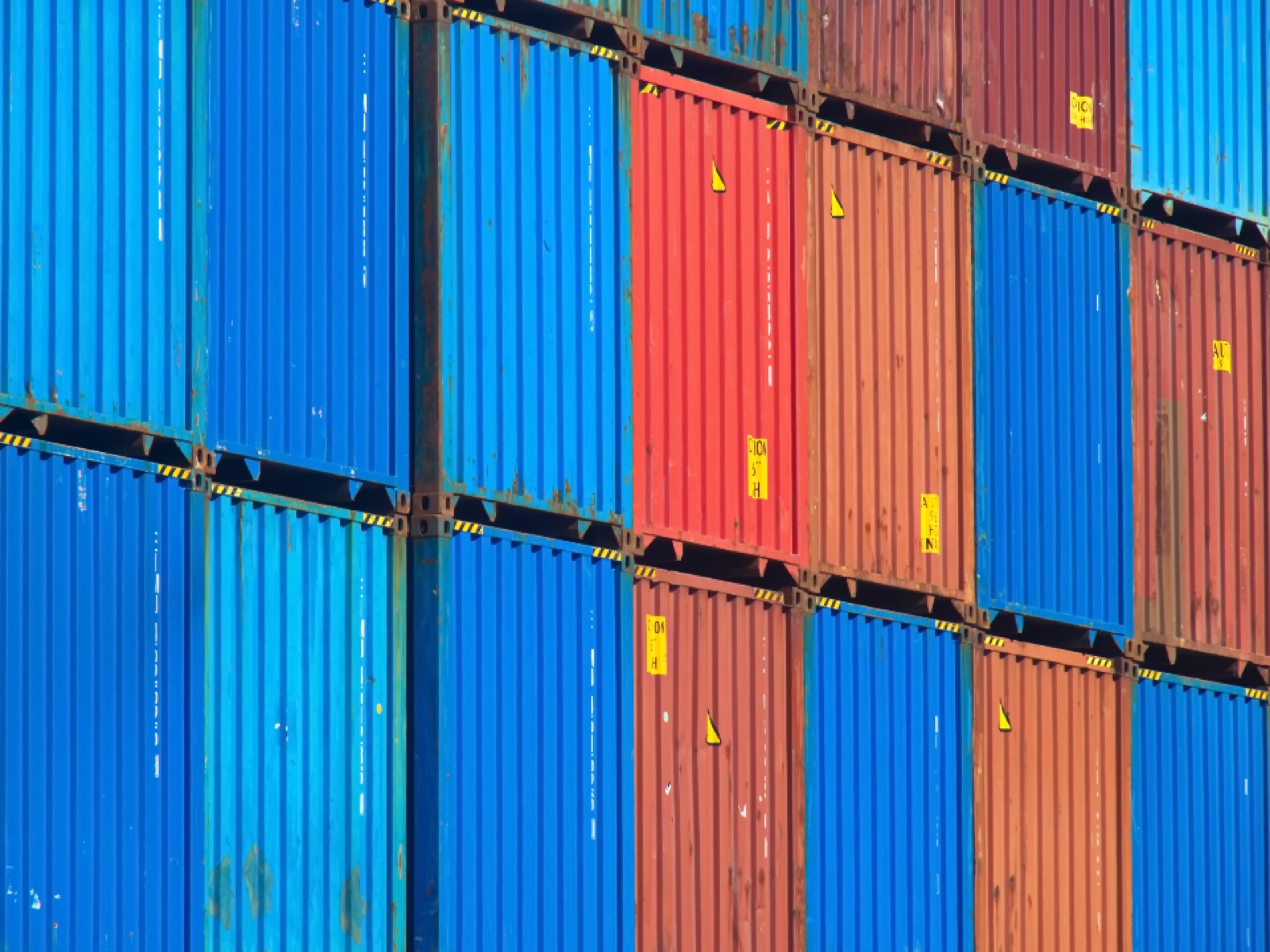 Stacked freight containers, representing secure logistics coordination